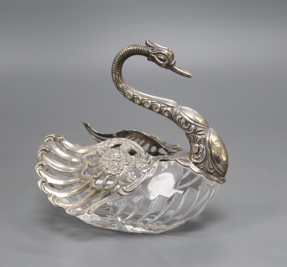 A cut glass pot pourri, in the form of a swan with embossed silver head and pierced hinged wings, London import marks for 1986
